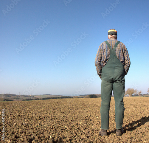 An farmer stands in his dry field on a glorious spring day and worries about the newly sown seed. Already in March it hardly rained and the fields have dried up. Climate change can be felt everywhere.