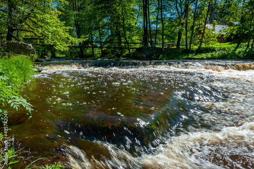 Rapids on the river Loobu. Joaveski limestone waterfall in Lahemaa National Park. Estonia. Baltic. Landscape on a spring sunny day. photo