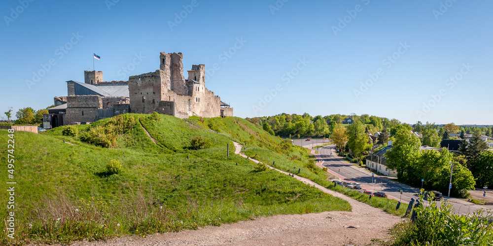 Landscape with medieval Rakvere castle, Estonia. Ruins of a medieval knight's castle in sunny spring day. Landscape with medieval Rakvere castle, Estonia. Ruins of a medieval knight's castle in sunny spring day.