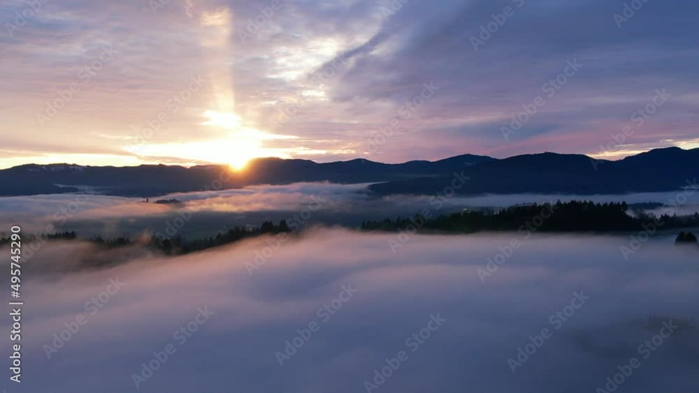 4k drone fog to sunset over clouds, mountains, and forest 4k drone fog to sunset over clouds, mountains, and forest