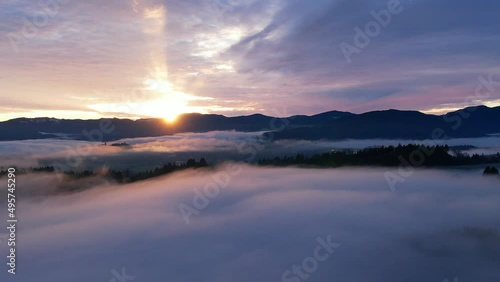 Wallpaper Mural 4k drone fog to sunset over clouds, mountains, and forest Torontodigital.ca