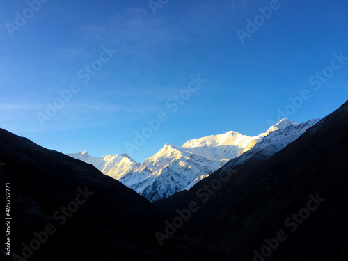 High mountains, glacier in the blue sky background 
