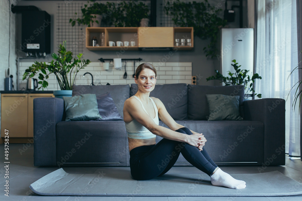 Woman at home doing morning exercises, doing fitness Woman at home doing morning exercises, doing fitness