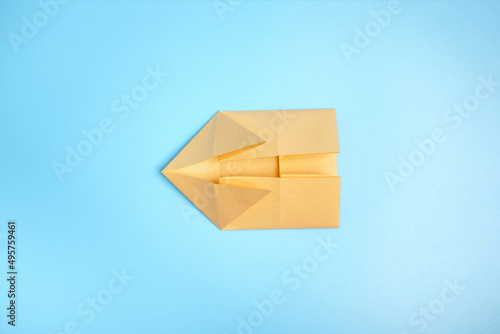 Origami Bunny. Step-by-step photo instruction on a blue background. Easter bunny. DIY concept Step4. Rabbit 2023