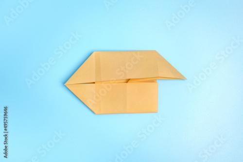 Origami Bunny. Step-by-step photo instruction on a blue background. Easter bunny. DIY concept Step6. Rabbit 2023 photo