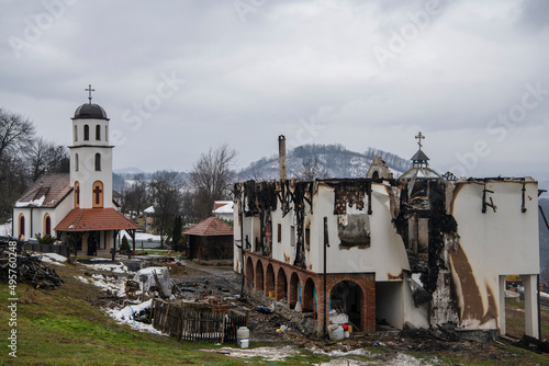 Burnt Holy Trinity Monastery in mountain village. The fire destroyed part of monastery building. Ruins of burnt out monastery. Ljubovija, Serbia 05.02.2022 photo