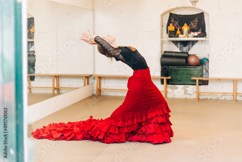 Flamenco woman dancer on a bohemian dance studio training photo