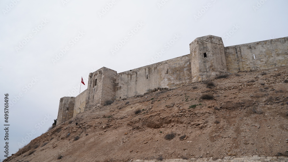 Ancient Walls of Gaziantep Castle and Turkish Flag