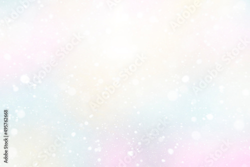 Abstract blurred background of delicate watercolor color, with the effect of bokeh and falling snow. Spring background, or Christmas background.