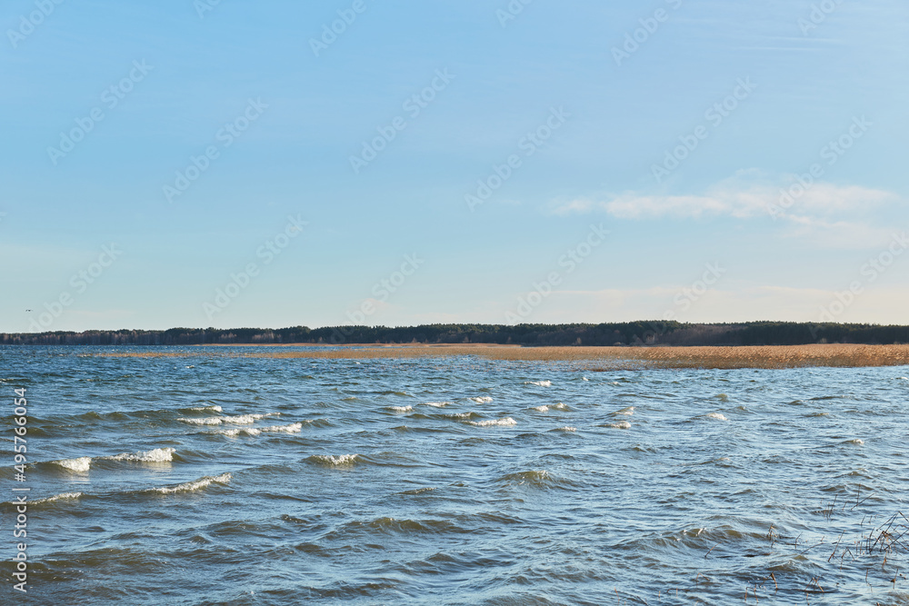 landscape of lake with waves blue sky with clouds Svityz Ukraine 