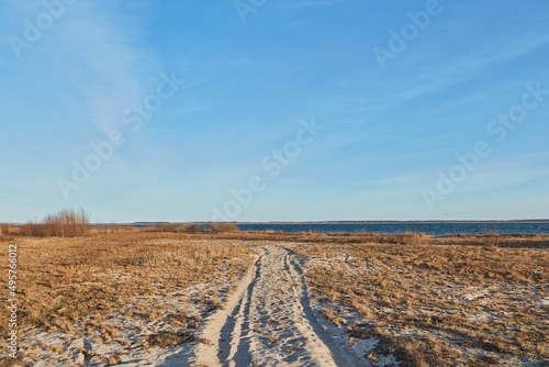 rural landscape road at he beach on the lake with blue sky and clouds Ukraine 