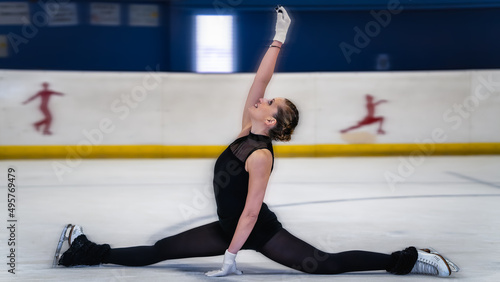 Woman doing a nice figure in ice skating with motion blur effect