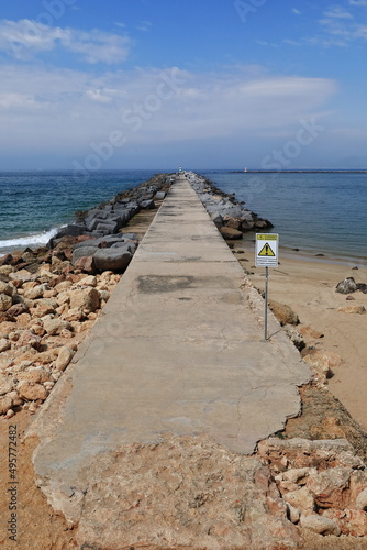 Port s east mole-Arade river mouth-danger warning sign-Ferragudo side. Portimao-Portugal-169