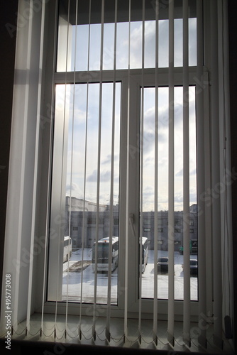 Office window with vertical blinds