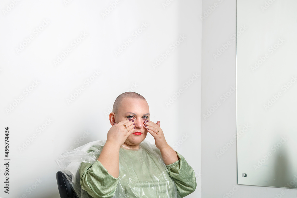 An Orthodox Hasidic Jewish woman cries in her hairdresser's chair after