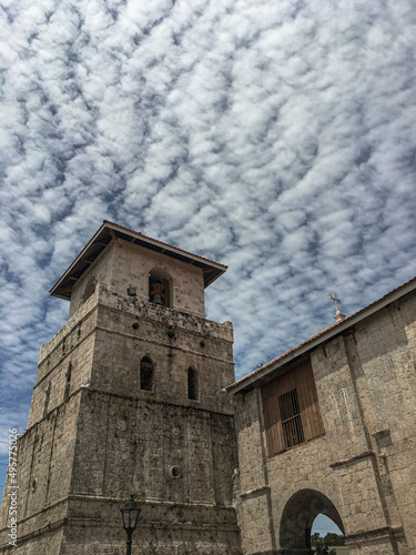 Low angle shot of the Baclayon Church in the Philippines and a cloudy sky photo