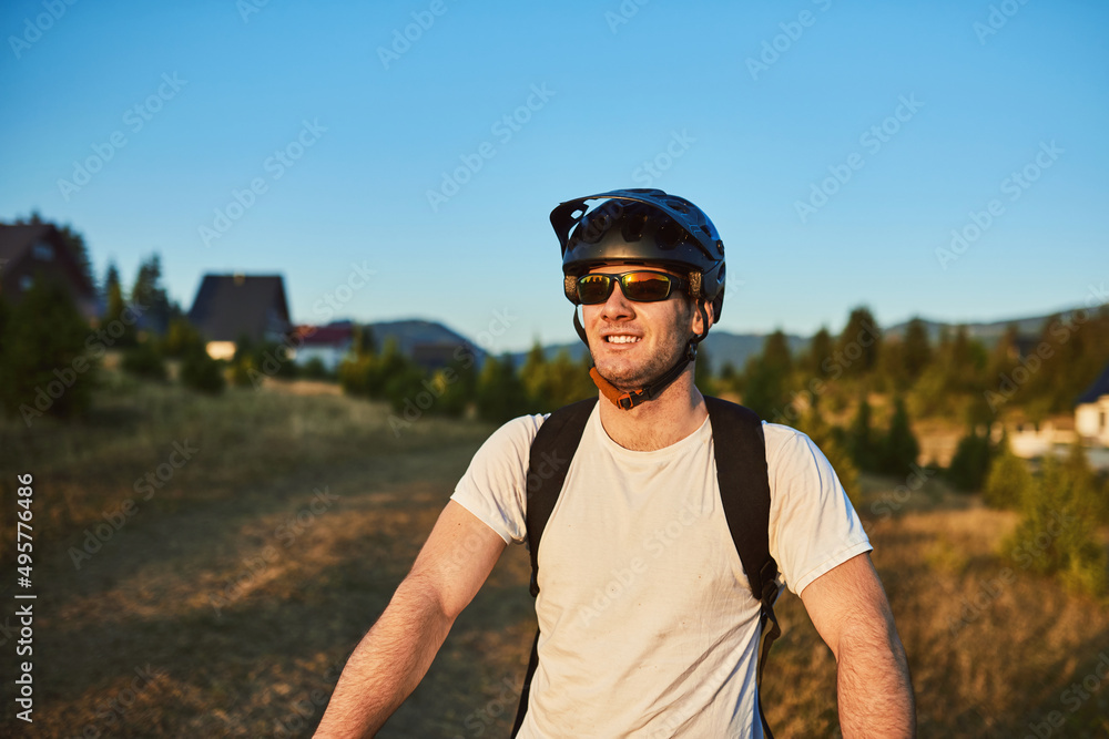 Cyclist Riding the Bike on the Trail in the Forest. Man cycling on enduro trail track. Sport fitness motivation and inspiration. Extreme Sport Concept. Selective focus Cyclist Riding the Bike on the Trail in the Forest. Man cycling on enduro trail track. Sport fitness motivation and inspiration. Extreme Sport Concept. Selective focus