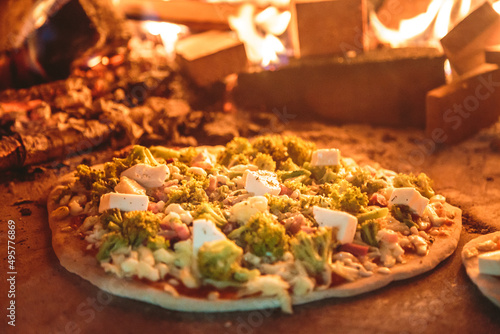 Pizza in the oven with flare in the background photo