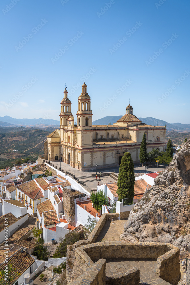 View of the beautiful white village of Olvera with the parish church of Our Lady of the Incarnation, 18th century in neoclassical style, in the upper part of the city, Cadiz province, Andalusia, Spain