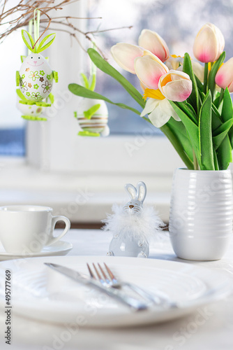 Easter table setting. Easter dinner with colorful Easter eggs. Easter background. Christ is risen