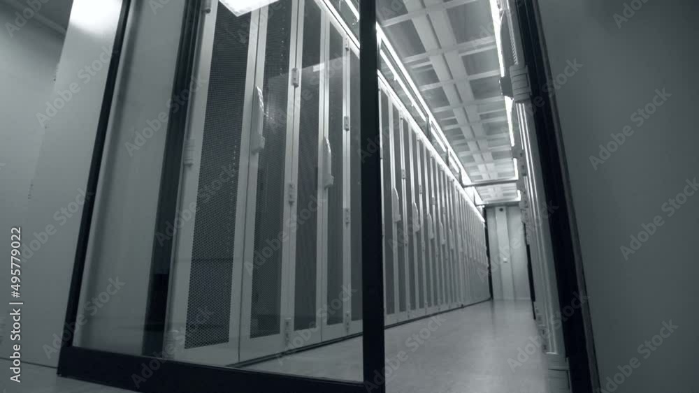 Shot of Corridor in Working Data Center Full of Rack Servers and Supercomputers. Shot of Corridor in Working Data Center Full of Rack Servers and Supercomputers.