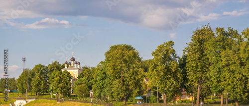 Park and ancient church on the embankment in the ancient Russian city of Uglich photo