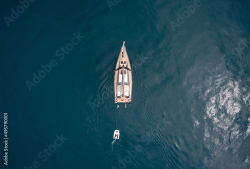 Aerial drone photo of a sail boat in the ope sea