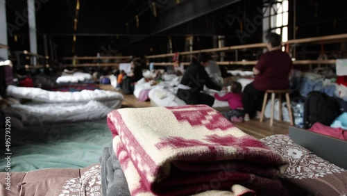 Millions of refugees from the war-torn territories are flees to europe. Mother and child room. Mattresses, pillows, blankets are waiting for refugees, temporary housing during humanitarian disaster photo