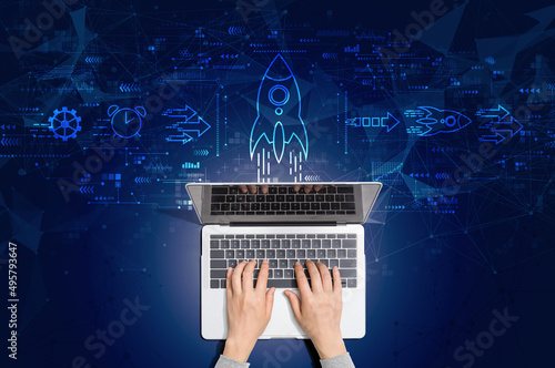 Rapid growth concept with person using a laptop computer photo