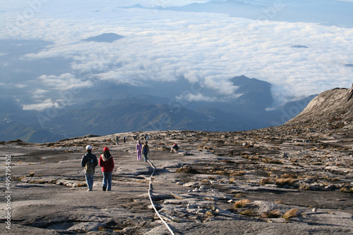 Tourists hiking down the Kinabalu mountain photo