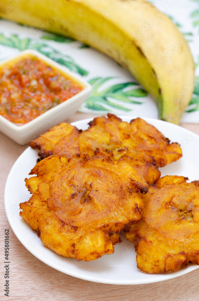 Patacones or fried tostones of green or ripe plantain, with a crispy ...