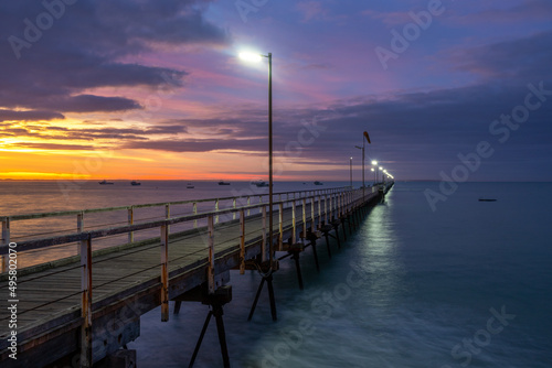 A pastel sunrise over the iconic Beachport Jetty located in the southeast of South Australia taken on February 20th 2022