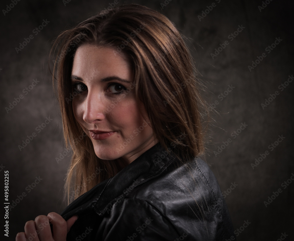 Fototapeta premium Close-up shot of a young attractive woman in her mid 20s - studio photography