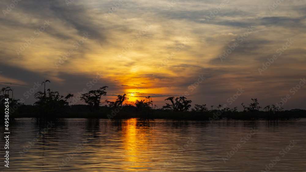 Beautiful sunset over an lake in the Amazon rainforest of Ecuador, South America