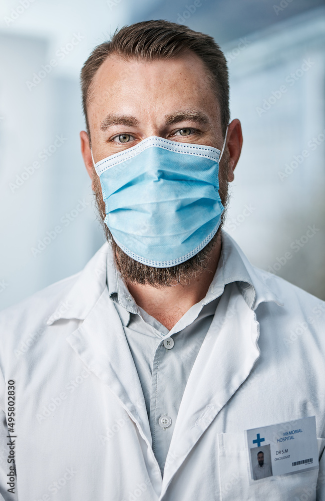Doctors have experienced increased demands and risks during the pandemic. Portrait of a medical practitioner wearing a face mask in a hospital. Doctors have experienced increased demands and risks during the pandemic. Portrait of a medical practitioner wearing a face mask in a hospital.