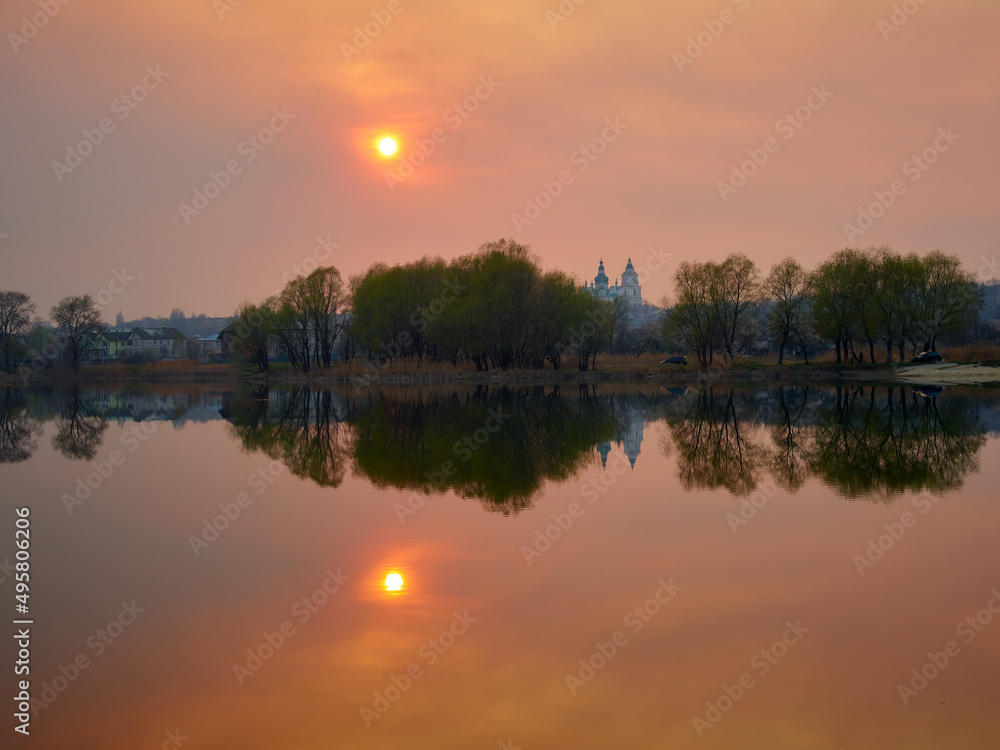Obraz premium red sunset over lake