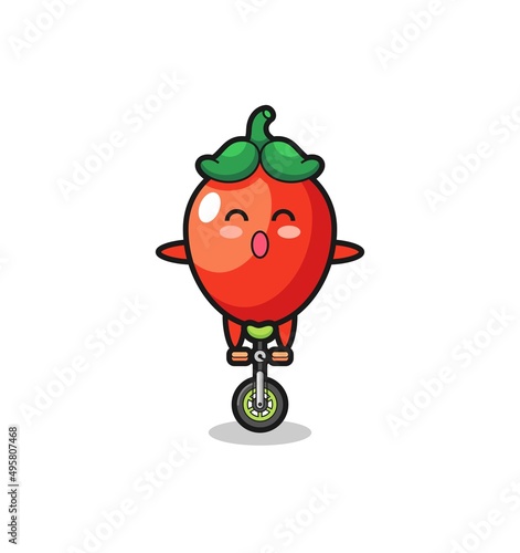 The cute chili pepper character is riding a circus bike