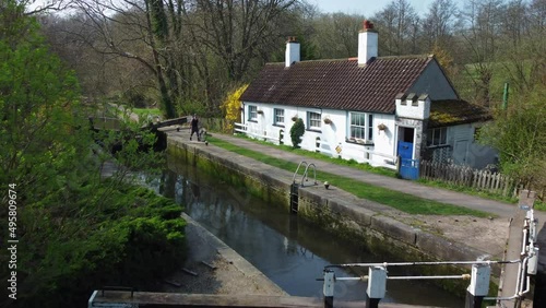 Aerial shot of Lock Keeper's Cottage and lock open Grand Union Canal, UK photo