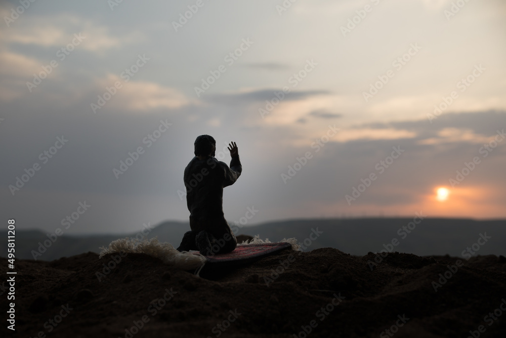 Silhouette of mosque building on toned foggy background. Ramadan Kareem background. Mosque at sunset. Praying people Silhouette of mosque building on toned foggy background. Ramadan Kareem background. Mosque at sunset. Praying people