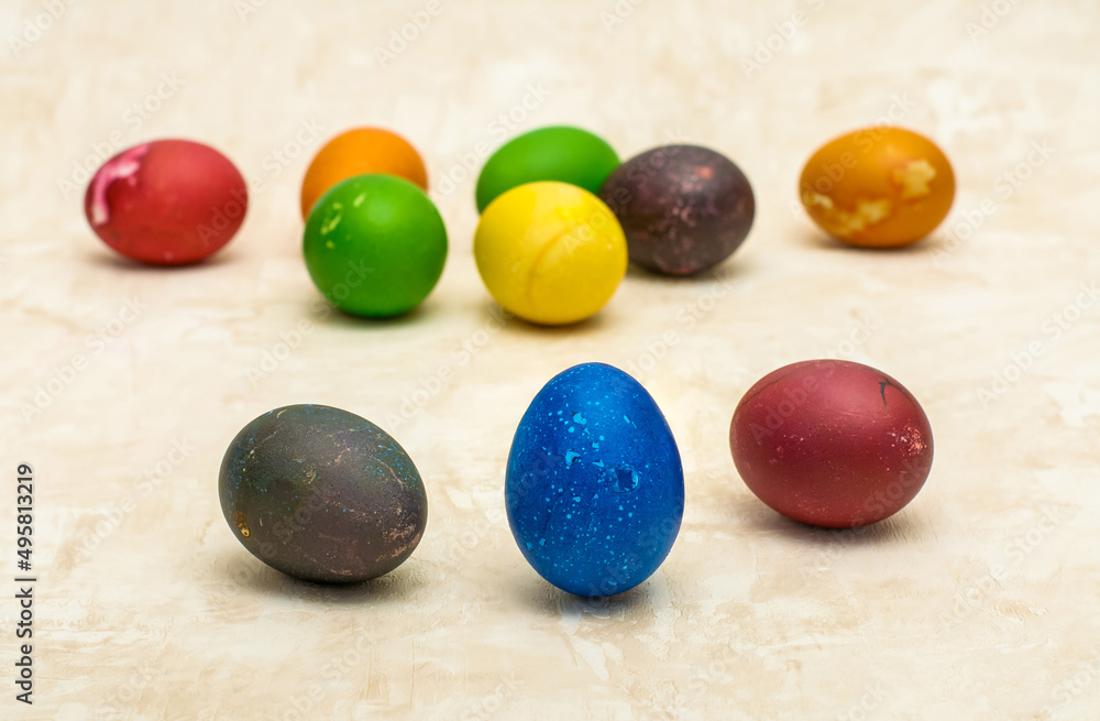 easter painted eggs on a beige background easter painted eggs on a beige background