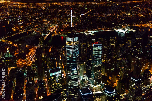 The city of New York City, Manhattan, aerial view at night.