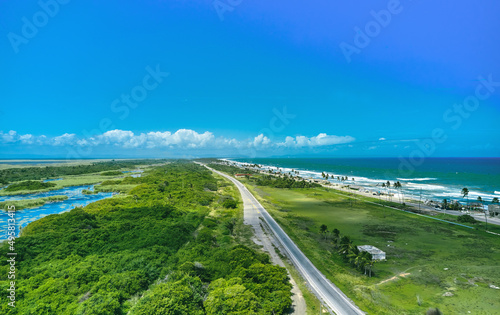Beautiful Caribbean road with palm trees along the coast of Venezuela, aerial view. photo