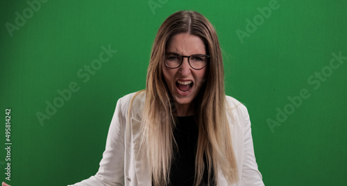 Young woman looks very irritated - studio photography