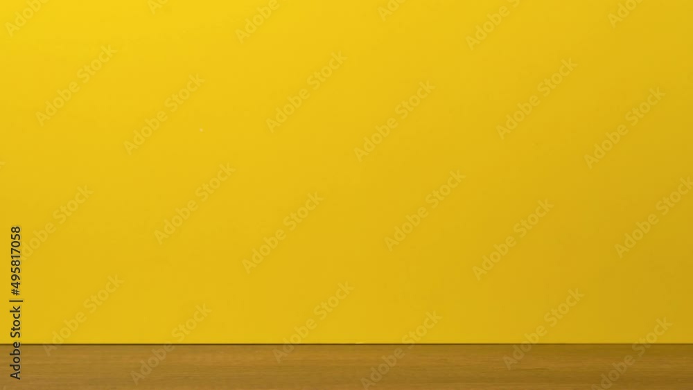Blue coffee cups and tea change places. Video footage 4k stop motion on yellow background. Blue coffee cups and tea change places. Video footage 4k stop motion on yellow background.
