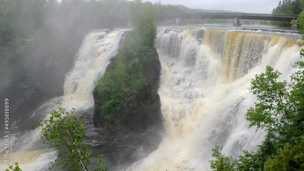 Kakabeka Falls Provincial Park in Thunder Bay in rain and fog with bridge in background Kakabeka Falls Provincial Park in Thunder Bay in rain and fog with bridge in background