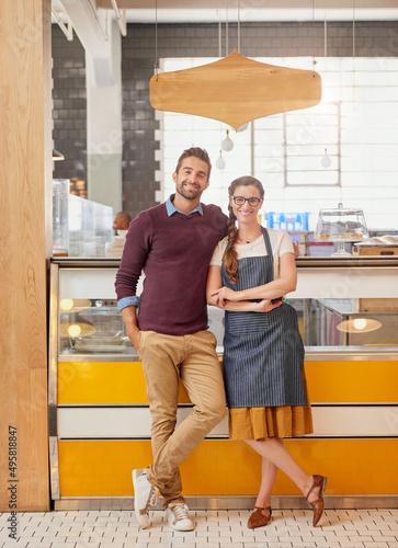 Hard work brought us this far. Portrait of two young business owners posing in front of the counter in their coffee shop. © Arnéll Koegelenberg/peopleimages.com