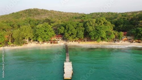 Aerial drone footage fly above wooden pier in tropic island Thailand, Koh Samed