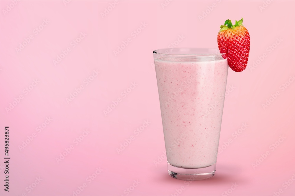 Glass of strawberry yogurt on color pastel background Glass of strawberry yogurt on color pastel background