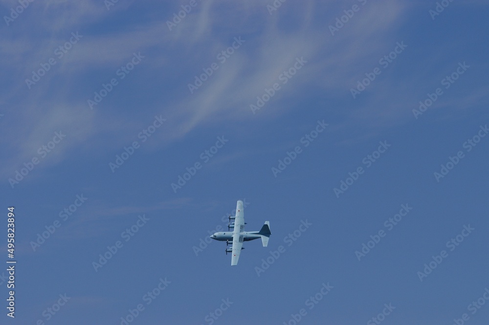Aircraft flying against the background of autumn blue sky Aircraft flying against the background of autumn blue sky