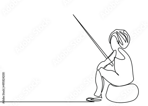 a boy is trying to fish from the pond and having fun